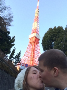 A kiss in front of the Tokyo Tower.